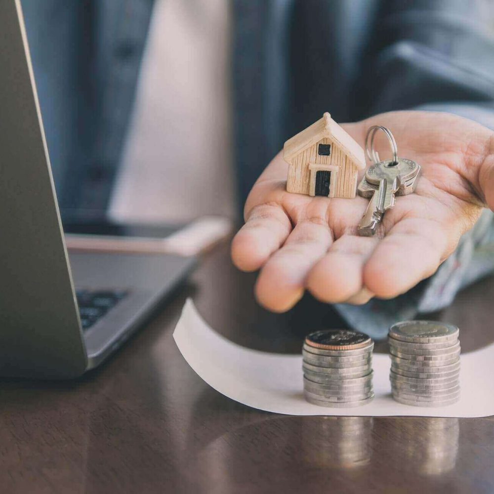 man-giving-key-house-to-customer-business-investme-ZCZLNTN.jpg
